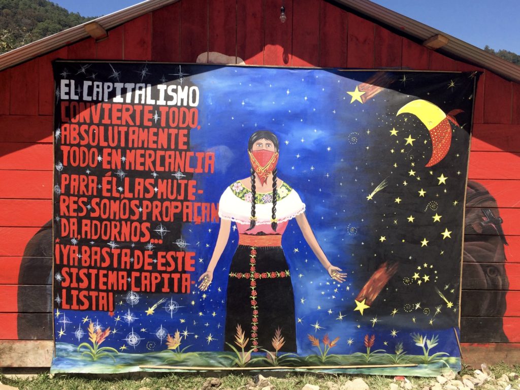A mural in the Zapatista Caracol reads: "Capitalism turns everything, absolutely everything, into a commodity. For it, women are propaganda, decoration. Enough with the capitalist system!" Photo by Heather Gies